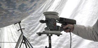 Instead of holding a sander above your head for hours, use a foam block, boat hook and zip ties to create a support. (Photo/ Bert Vermeer)