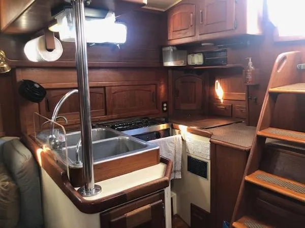 Gourmands will like the deep double sink of the Pacific 37's galley set-up, but sailors will like the secure U-shaped design that will keep pots, and people, from flying while close-hauled on starboard. Photo courtesy of Boats.com.