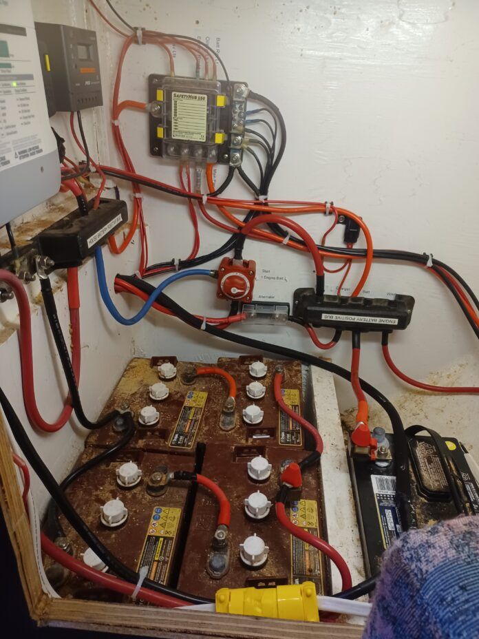 The batteries pictured are Rolls S6 250 flooded cells, nominally 281 a/hr. They came with the boat and are of unknown age but currently seem to work OK. They are not the cell I would pick as they are a lightweight battery. The clue is that the spec sheet gives a CCA number. True deep cycle cells don't have that. The taller L16-EX is rated at three times the cycle life, about 3,750 cycles to 50% DoD compared to these at 2,000. You really do need to look at the full spec to know what you are getting! In Canada these are currently around $320 com-pared to the L16 at $590. The black battery is the starter battery which is a simple H/D car battery that starts the engine and supplies the windlass. (Photo/ Roland Stockham)