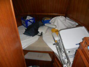 It's not respectful to the surveyor to leave your sleeping quarters in this fashion. Declutter and organize. Usually, the surveyor will ask the owner to move the stuff. If the owner is not present, the area goes uninspected, and such is noted in the survey. (Photo/ Ray Ville)
