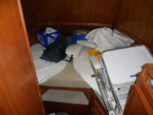 It's not respectful to the surveyor to leave your sleeping quarters in this fashion. Declutter and organize. Usually, the surveyor will ask the owner to move the stuff. If the owner is not present, the area goes uninspected, and such is noted in the survey. (Photo/ Ray Ville)