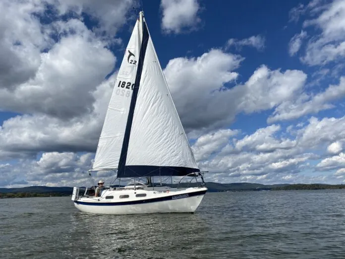 IMG_1508 (1) The author’s Tanzer 22 Ardmore sailing in light air on the Haverstraw Bay stretch of the Hudson River. The aged genoa’s wrinkling was due, in part, to a low-cost roller reefing system that was later replaced. (Photo/ Doug Henschen)