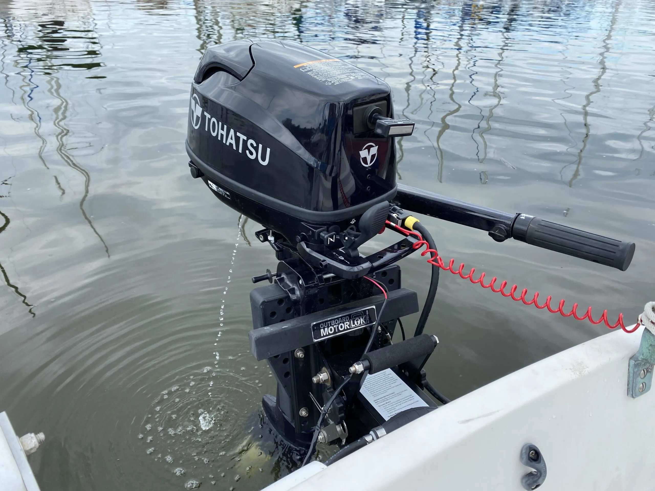 Tohatsu’s four-stroke, extra-long-shaft Sail Pro 6 hp outboard proved clean, quiet, fuel efficient and reliable while a beefy outboard bracket ensured easy lifting and steady power in sloppy seas. (Photo/ Doug Henschen)