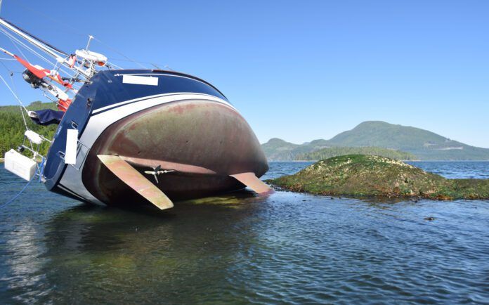 DSC_4530 (1) The captain made a navigational miscalculation so this 2005 Sabre 386 rested on a shelf just outside Cameleon Harbour in British Columbia for the tide to return. As a result of this temporary grounding, seagrass entered and blocked a through-hull. Identifying details have been omitted at the request of the captain. (Photo/ Bert Vermeer)