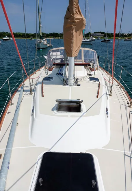 The Tartan 3700 side shrouds are set well inboard for close sheeting angles upwind. The deck has plenty of opening hatches for ventilation, and a huge escape hatch over the forward berth. Budget for teak touch ups for the handholds and the toe rails. Courtesy of Yachtworld.com and McCann Yachts.