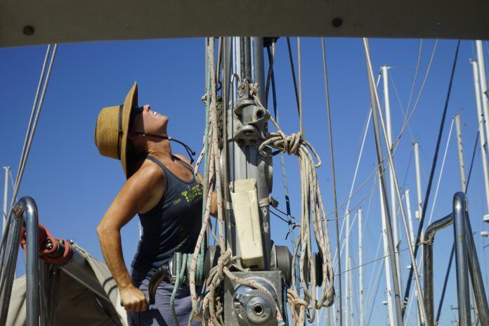 Hauling Jamie up the mast. Sailing Totem's Behan Gifford says she’s a much happier human being when on a boat.