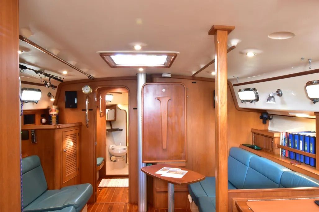 Note the drop-down table stowed on the bulkhead. In this age of the chartplotter, you still need that big old-fashioned nav table for paper charts if the electronics decide to hiccup. Courtesy of Yachtworld.com