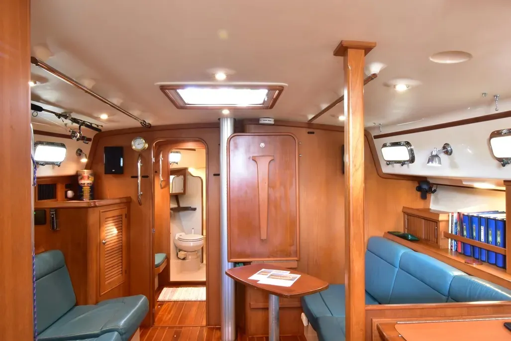 Note the drop-down table stowed on the bulkhead. In this age of the chartplotter, you still need that big old-fashioned nav table for paper charts if the electronics decide to hiccup. Courtesy of Yachtworld.com