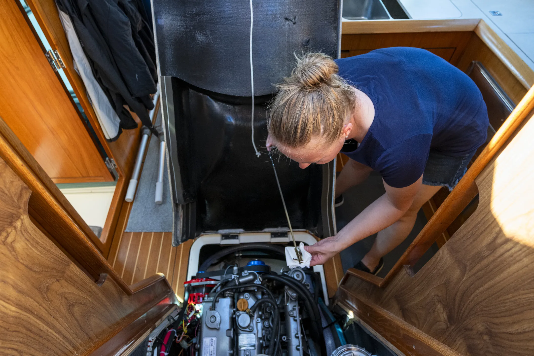 Make sure crew know how to do routine maintenance tasks like checking the engine oil. (Photo/ AscentXmedia/ Getty)