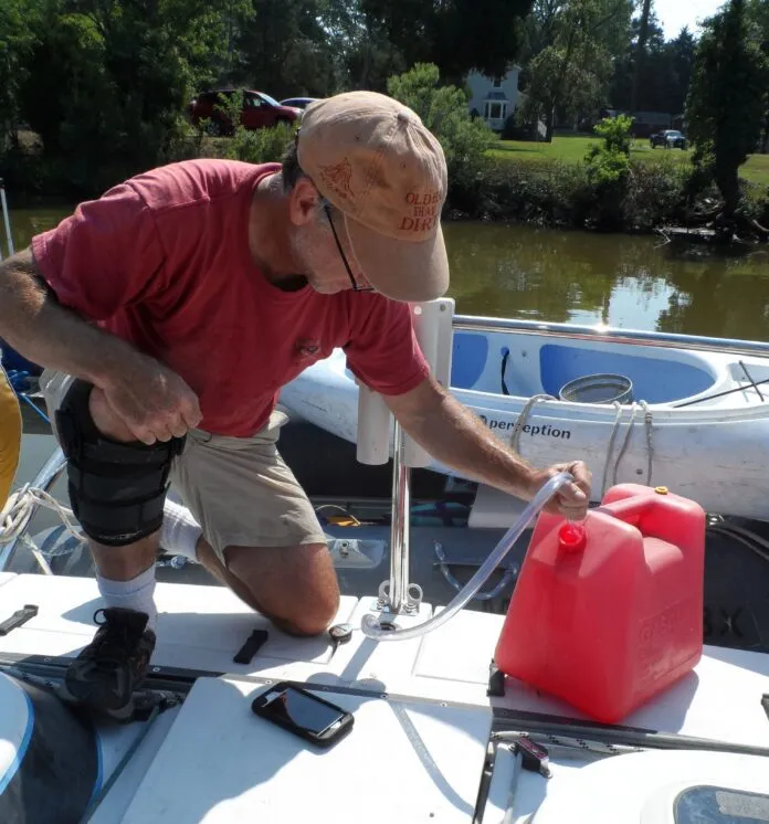Testing the shaker siphon. The most spill-proof, low-strain way to transfer fuel from a jerry can to the tank. Yes, there are motorized versions and versions with a pump-bulb, but all these do is make it more complicated. (Photo/ Drew Frye)
