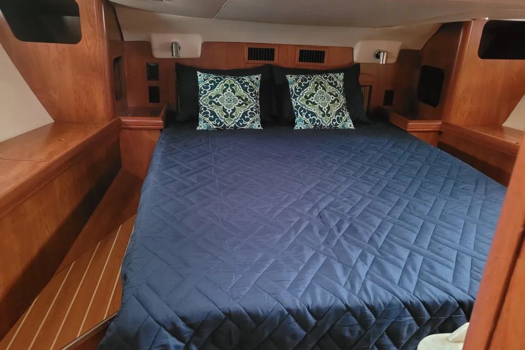 This master suite boats a queen-sized double and a settee bench for pulling on your pants, although the headroom isn't great. Courtesy of Yachtworld.com