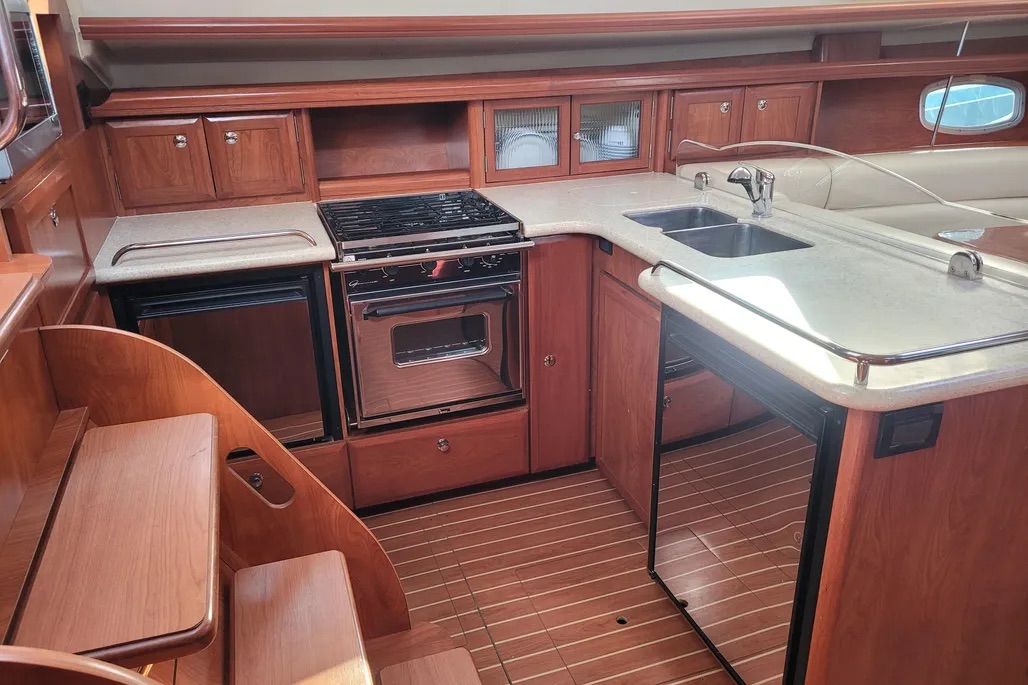 The Hunter 45DS boasts tons of interior space, which equates to a highly functional galley on the port side as you descend the companionway. Courtesy of Yachtworld.com
