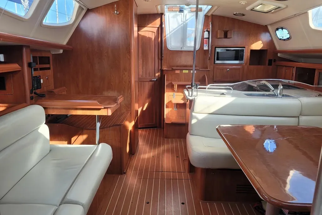 Another view of the galley area amidships conveys the sense of space through this area of maximum beam. Just aft of the big, well-equipped nav station is the access for the aft cabin. Kudos to Hunter for deleting any serious head knockers back there. Courtesy of Yachtworld.com