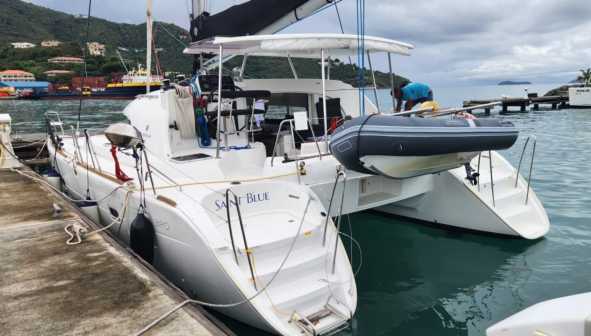 Built-in davitz on the stern allow for easy dinghy lowering and raising. In bumpier conditions, make sure someone is holding the dinghy painter line so the outboard doesn't crash into the opposite hull. (Photo/ Marc Robic)