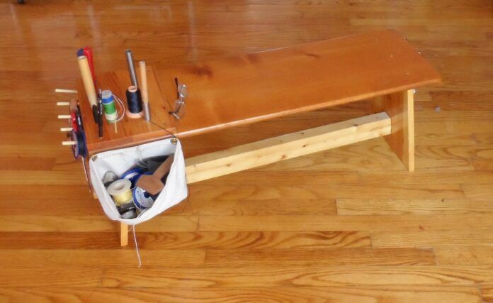 This finishing bench is a rough copy of one I saw in a sailmaker’s workshop. It is both a piece of furniture and an efficient tool for periodic sail maintenance. (Photo/ Drew Frye)