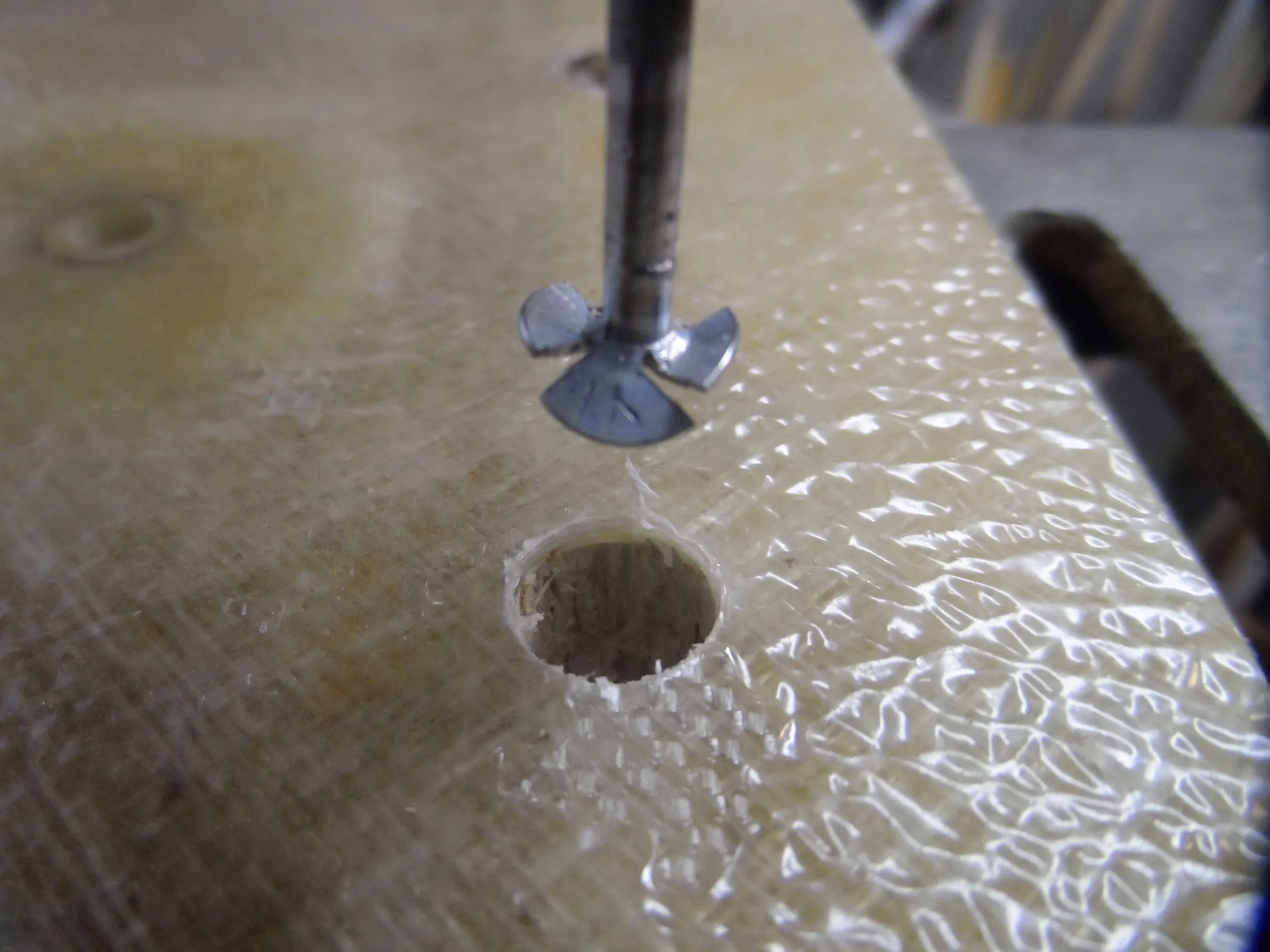 Roofing nail core remover. It is easier to control than a bent nail and makes finer, easier to remove dust. It does a better job of cleaning the top and bottom skins. It cuts deeper than a Dremell cutter. (Photo/ Drew Frye)