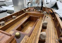 Tally Ho: Historic Boat Review Tally Hos' spacious cockpit, winches close at hand. Alaskan yellow cedar decking with teak trim. The original main sheet gibe buffer is visible over the bronze tiller. Note the high bulwarks without lifelines. (Photo/ Bert Vermeer)