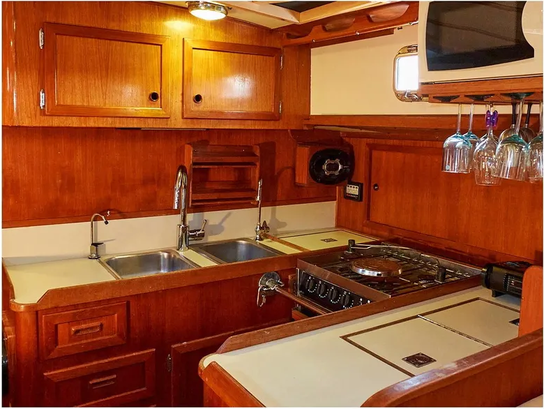 The U-shaped galley features plenty of counter space for food prep and ample drawers and overhead cupboards for storage.