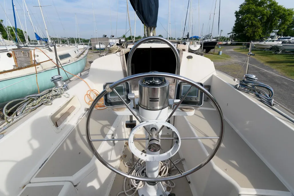The cockpit is fairly compact due to the boat's generous interior volume, but provides good working space for crew. The mainsheet traveler location on the bridgedeck can interfere with dodger installation but offers excellent control for short-handed sailing. Courtesy of Yachtworld.com