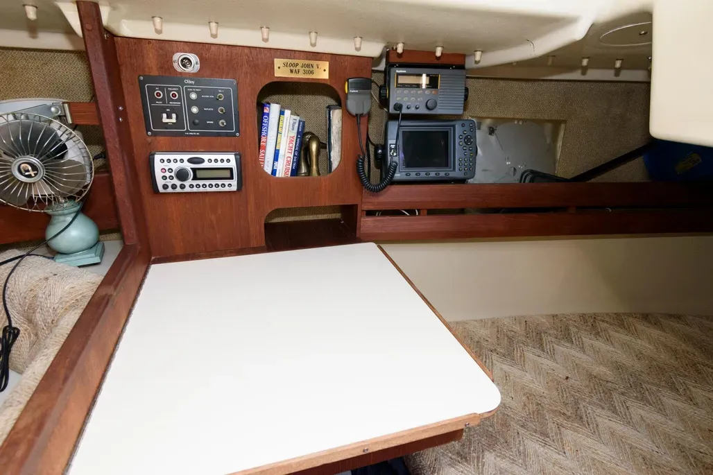 The navigation table is compact but functional, with a small chart table, drawers and dedicated space for electronics. While it is an efficient use of space, it can feel cramped, and access to the quarterberth is somewhat restricted. Courtesy of Yachtworld.com