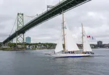 Canada’s “Tall Ship” Still Pulling Duty After a Century HMCS Oriole sails under the Angus L. Macdonald Bridge in 2021. (Photo courtesy of Government of Canada)