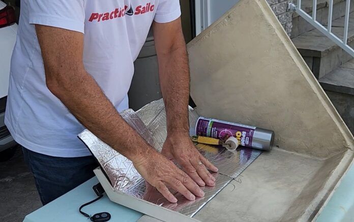 Applying the soundproofing material. (Photo/ Marc Robic)