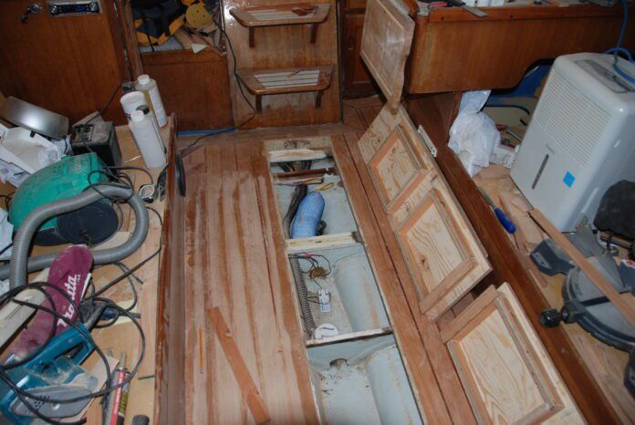 The cabin sole is in place, the bilge hatches with underside exposed showing the strong boxes created to prevent warping. (Photo/ Bert Vermeer)