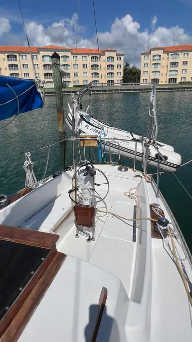 The cockpit layout is typical of 1970s design with adequate space but lacking modern conveniences like scuppers that drain completely. The original winches are undersized, so we suggest beefing them up for easier genoa trimming. Courtesy of Yachtworld.com