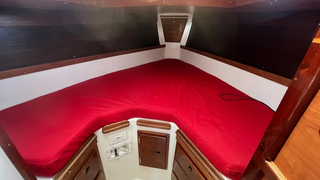The forward cabin lacks a privacy door—a significant drawback for family cruising—though a curtain was available as an option. On the plus side, good headroom extends well forward. Courtesy of Yachtworld.com