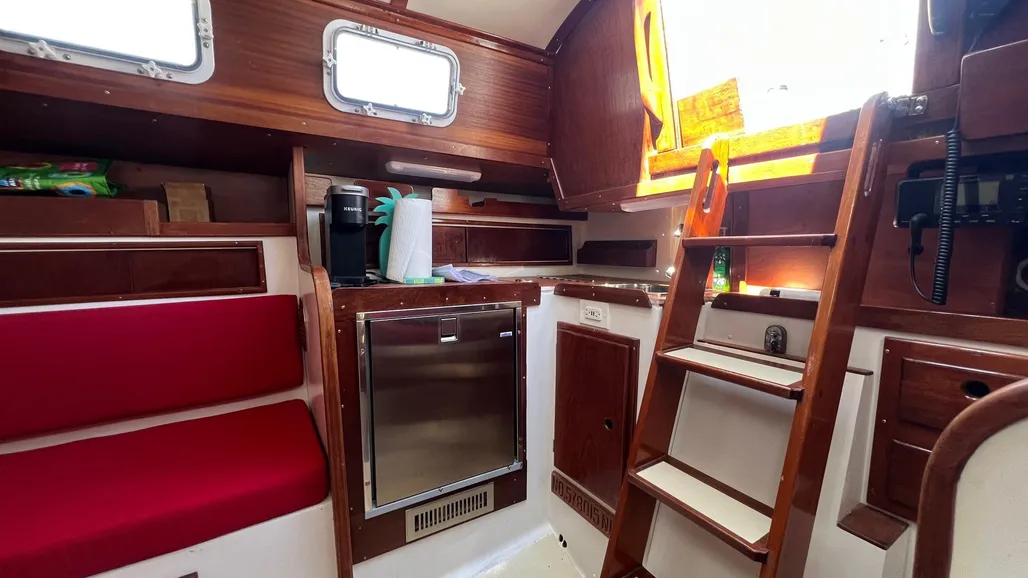 The compact galley reflects typical 1970s design priorities, with a huge 10-cubic-foot icebox, which is too roomy for a boat this length—we advise adding insulation. Courtesy of Sailboatdata.com