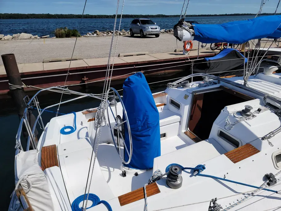 While the cockpit layout is comfortable, the molded non-skid surface isn't very effective when wet, and several owners report problems with deck components like cockpit locker covers that are too light and prone to cracking. Courtesy of Yachtworld.com