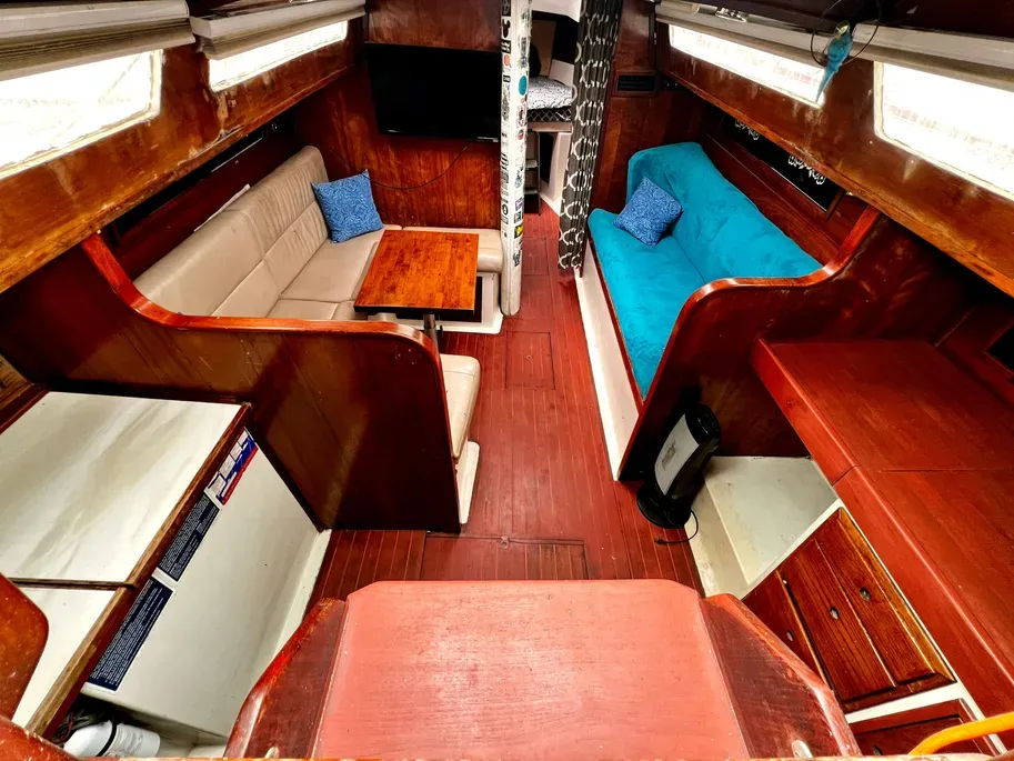 The main cabin showcases the Irwin 37's philosophy of maximizing interior volume, with comfortable settees and abundant natural light from numerous opening hatches. Courtesy of Yachtworld.com