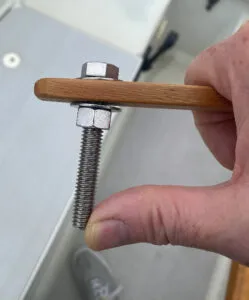 Keep the bolt on the pilot mount end a bit loose (but locked in place with thread-locking fluid) to make raising and lowering the stick over the tiller pin easier. (Photo/ Doug Henschen)