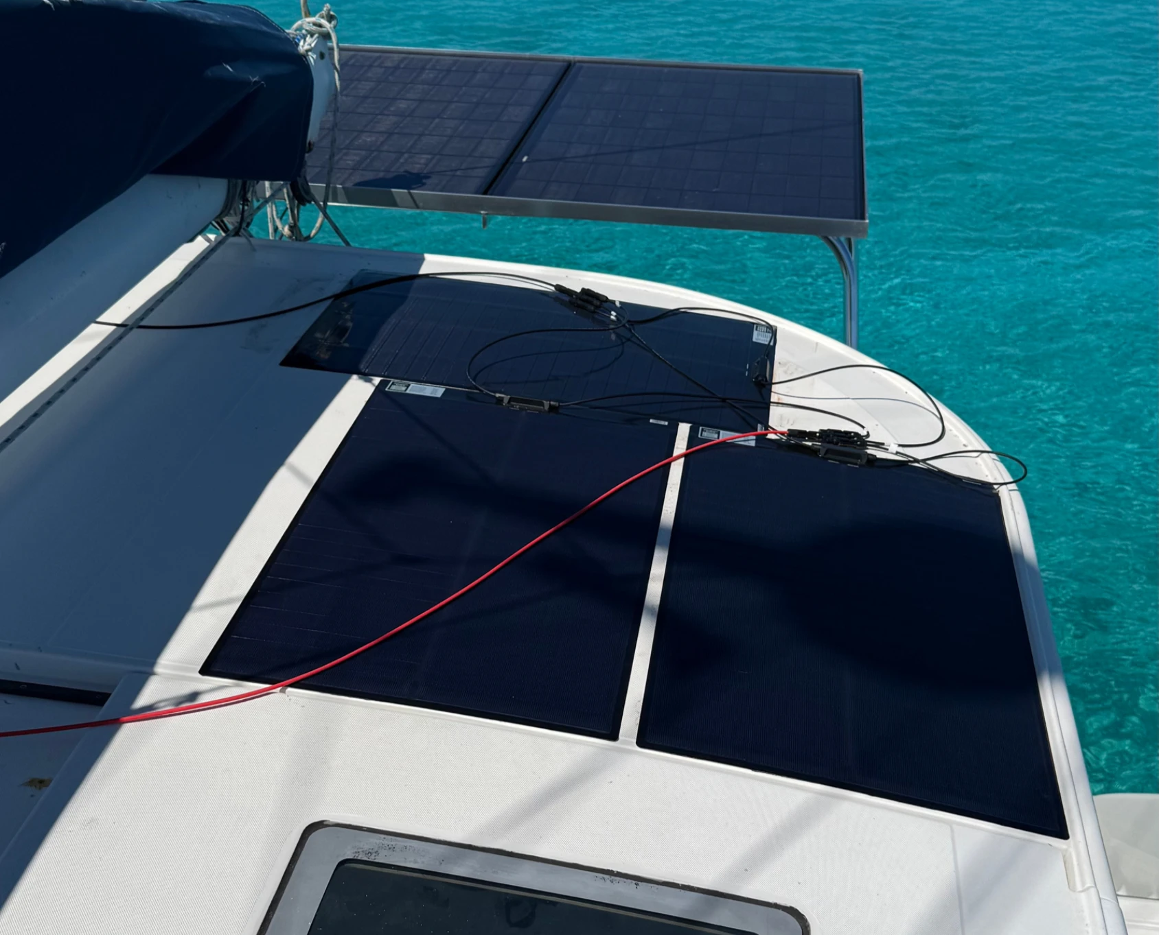 Confianza's solar setup, cables not yet managed. Note the amount of shading from the boom. (Photo/ Adam Morris)