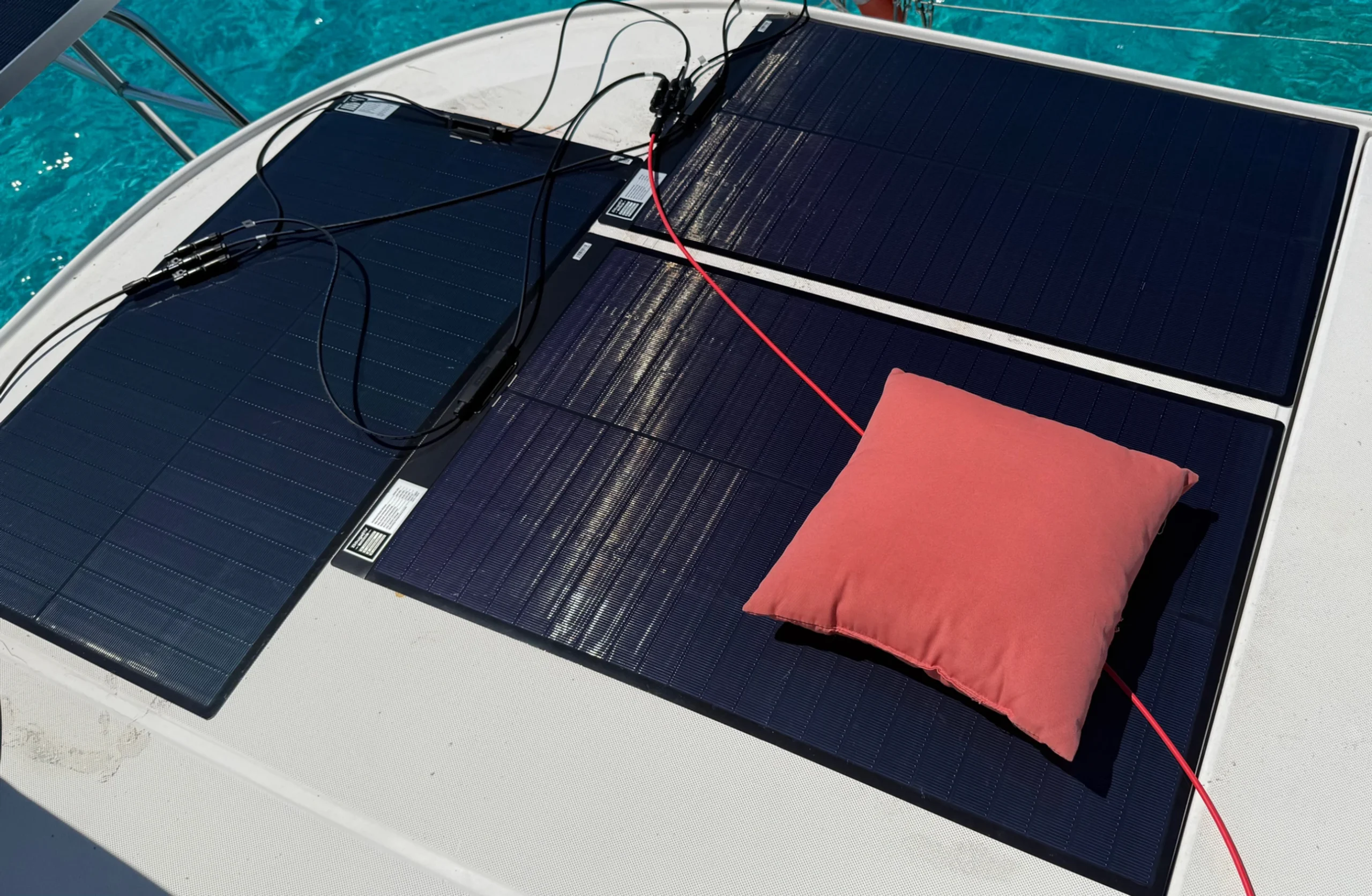 A pillow is placed on the solar panel to test how shading impacts power generation. (Photo/ Adam Morris)