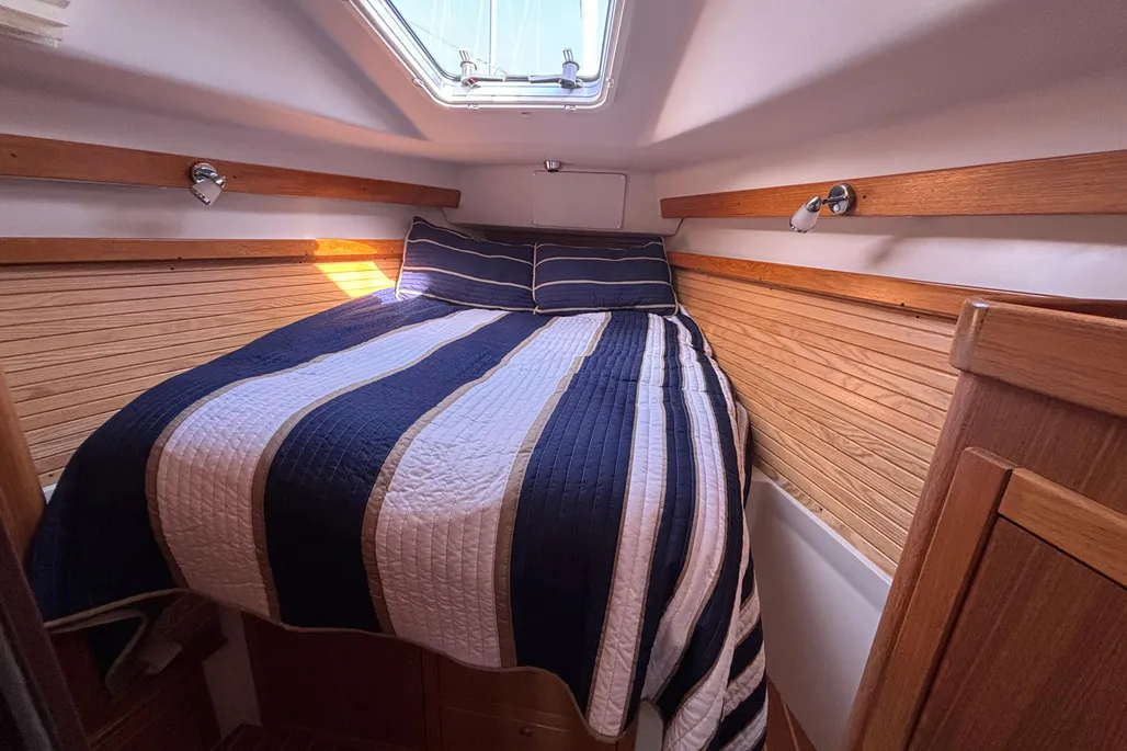 The forward cabin ditches the typical V-berth for a centerline arrangement that actually makes sense. Photo courtesy of YachtWorld.com