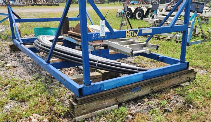 20250730_130121 (1) Marking BOW helps remove the guesswork from the haul-out process. Note: The front of the cradle sits on top of a treated wood 6 x 6 beam, which sits on top of two flat concrete blocks. Because my cockpit drains out the open transom, a 2 x 4 is added to make sure the front is higher and water can drain out of the back of the boat.(Photo/ Marc Robic)
