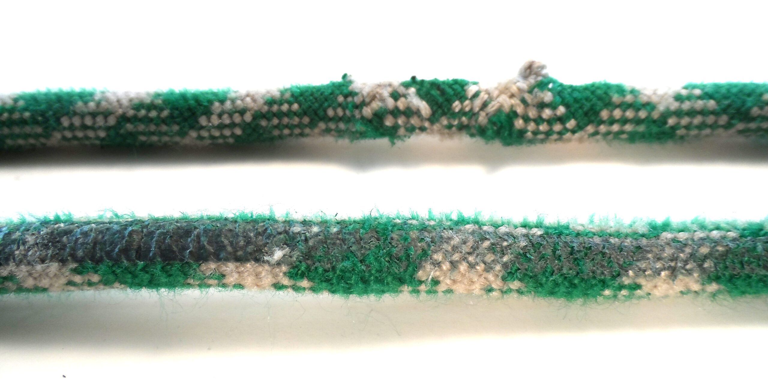 For comparison, a 10.5 mm nylon climbing rope melted over a smooth carabiner and partially ruptured after catching a falling climber (PS testing of mast climbing harnesses) that fell 6 feet. The tension on the rope and the force on the carabiner were about 1000 pounds. The rope moved about 12 inches due to stretch. After about 10 repeats of this fall, the rope will fail at about 17-22% of minimum breaking strength, largely the result of heat damage. This is a common failure mode for climbing ropes. (Photo/ Drew Frye)