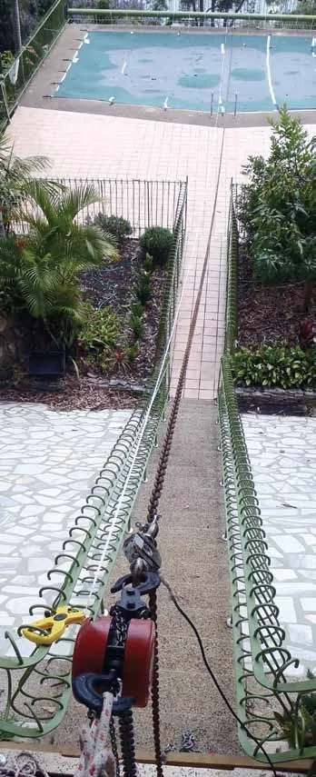 PS tests the catenary on 100 feet of 5/16-inch chain at a 5:1 scope to determine the tension when the last link is lifted: 190 pounds.
