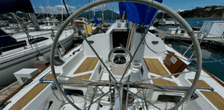 The 36.7's cockpit emphasizes racing functionality with its large stainless steel wheel and full-beam mainsheet traveler. The convertible cockpit seats can be shortened by 20 inches to create more working space for sail trimmers in racing mode. Courtesy of YachtWorld.com