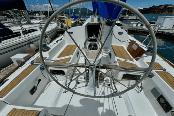 The 36.7's cockpit emphasizes racing functionality with its large stainless steel wheel and full-beam mainsheet traveler. The convertible cockpit seats can be shortened by 20 inches to create more working space for sail trimmers in racing mode. Courtesy of YachtWorld.com