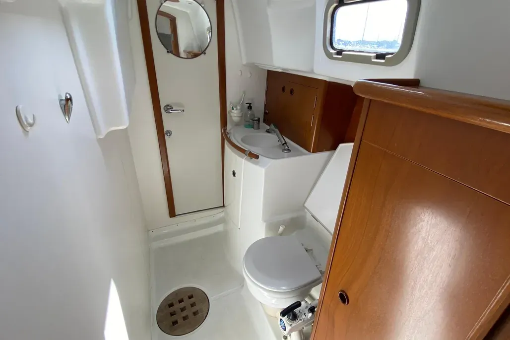The starboard head compartment's generous proportions are rarely found in 36-foot boats. The separate shower area and good ventilation make this a practical arrangement for extended cruising. Courtesy of Yachtworld.com