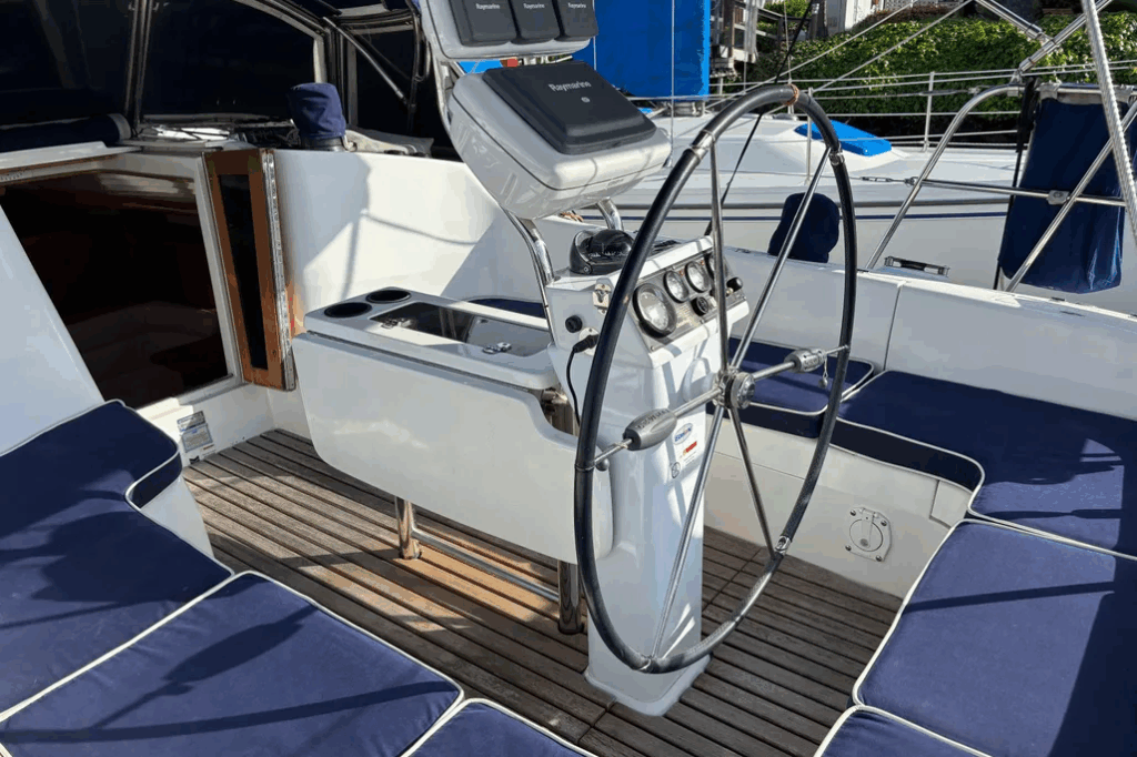 Quality gear throughout: Harken winches, Spinlock clutches, and a Garhauer traveler. That fixed cockpit table looks great for entertaining but turns into an obstacle course when sailing. Courtesy of Yachtworld.com