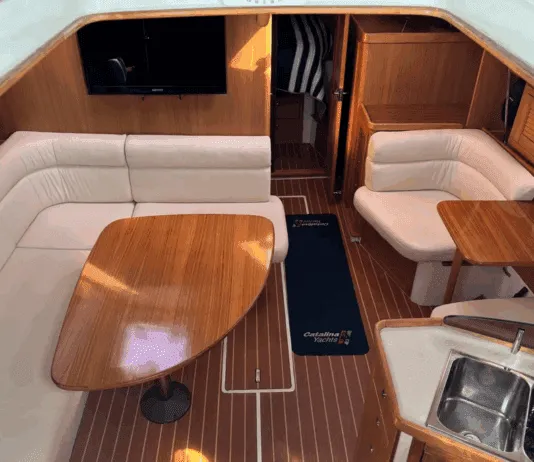 Catalina 375 Used Boat Review Warm varnished teak and solid wood doors create a space that feels substantial without being dark. The convertible furniture tries to solve the age-old problem of making one space do everything. Courtesy of Yachtworld.com