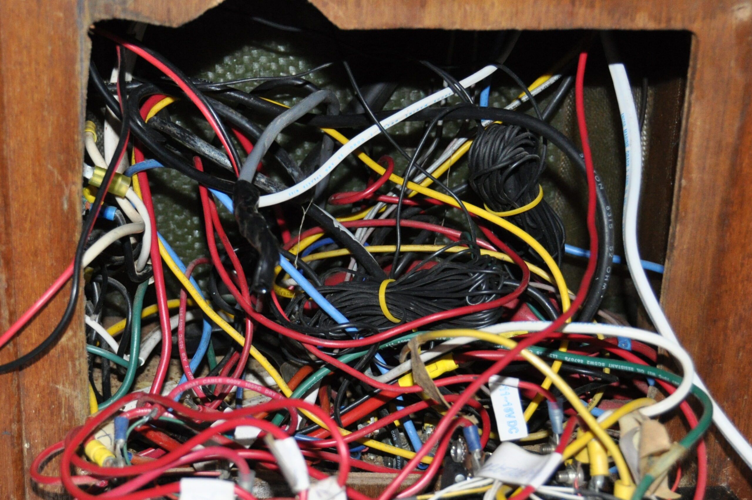The wiring mess behind the panel when purchased. (Photo/ Bert Vermeer)