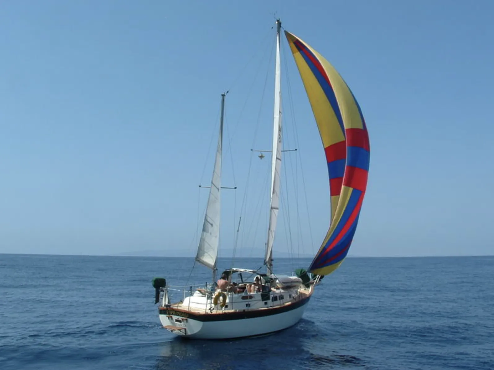 With her substantial rig and roller furling genoa, the Irwin 37 offers manageable sail handling for couples. The wide sidedecks and low bulwark forward make working on deck feel secure. Courtesy of SailboatListings.com