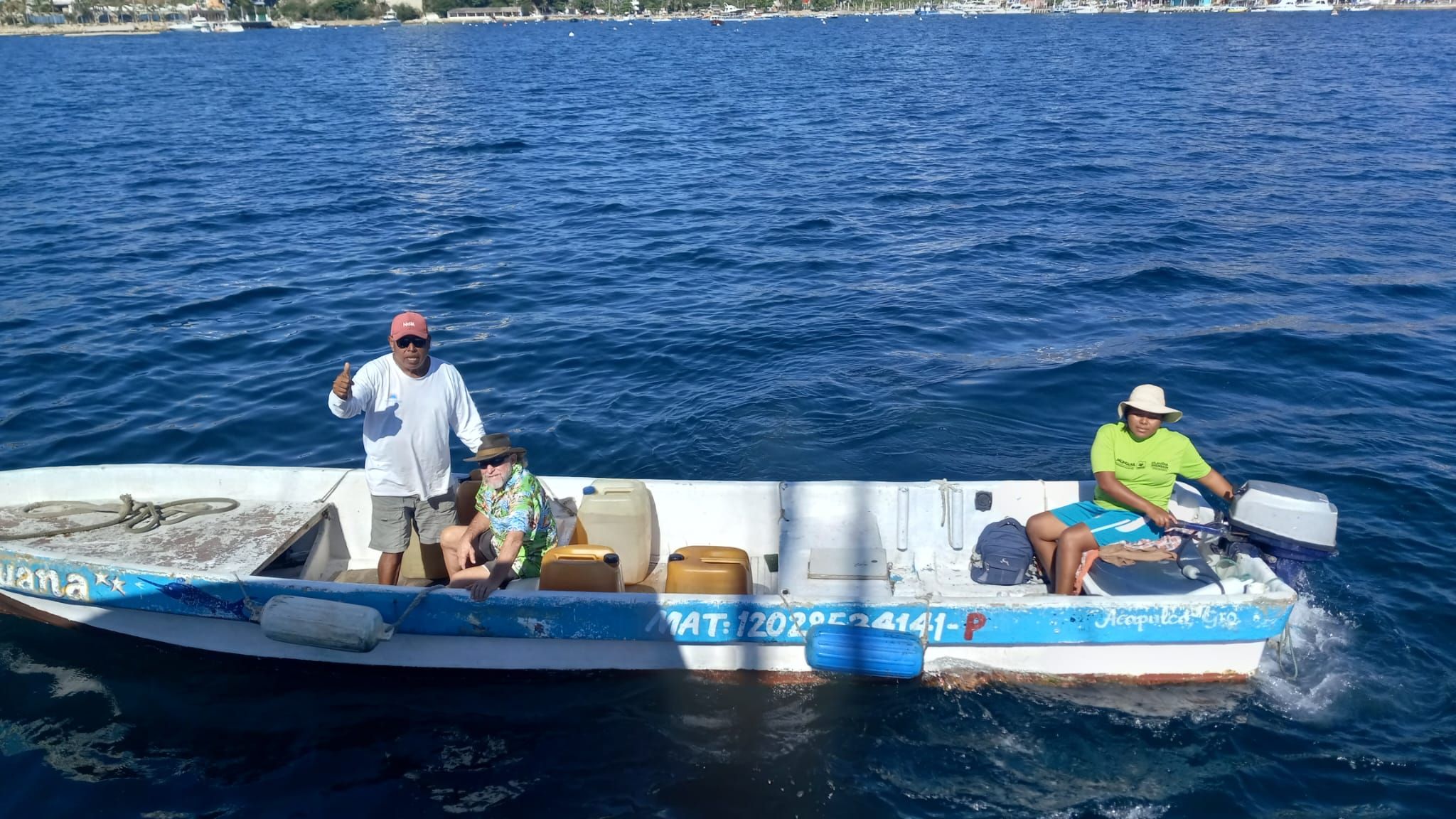 Vincente in Acapulco Bay in his panga with his daughter Maria. (Photo/ Pamela Bendall)