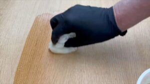 Applying polyurethane to the newly cut bulkhead. (Photo/ Steve Milan)