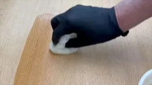 Applying polyurethane to the newly cut bulkhead. (Photo/ Steve Milan)