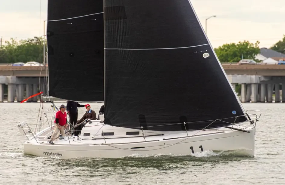 Bruce Farr-designed lines, like the characteristic flat sheer, plumb bow, and reverse transom, mark the First 36.7 as a modern performance cruiser. Courtesy of YachtWorld.com